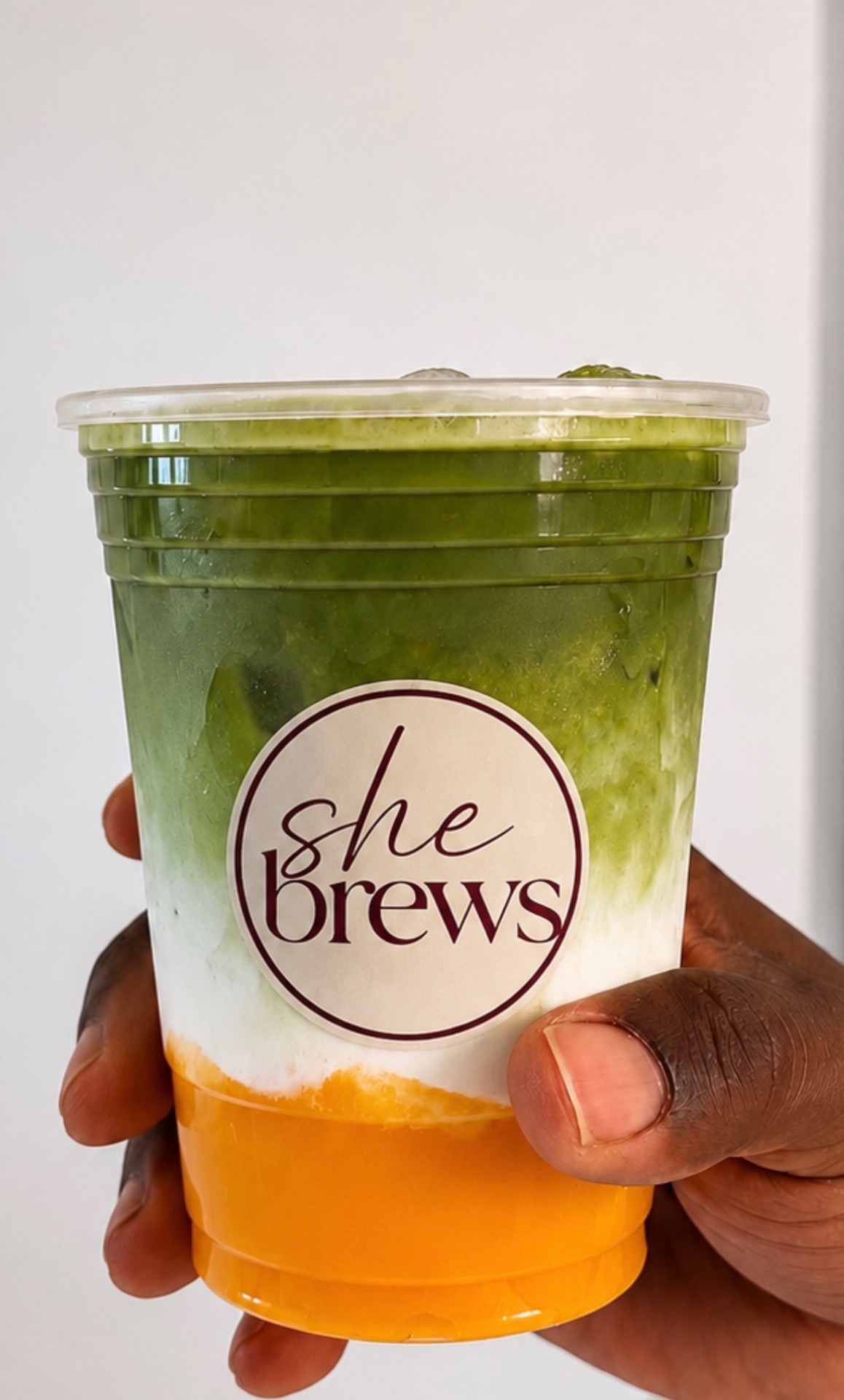 Layered mango matcha in a She Brews cup
